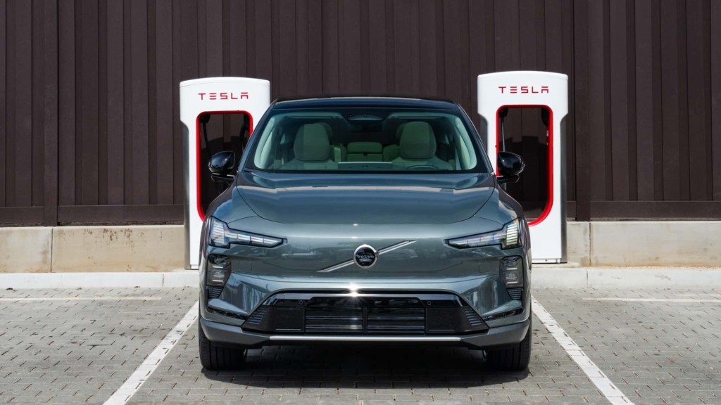 a-volvo-ex60-at-a-tesla-supercharger
